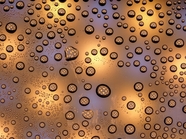 折射光芒的水滴背景摄影图片