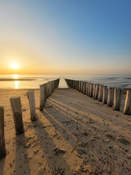 唯美黄昏海滩落日夕阳余晖摄影图片