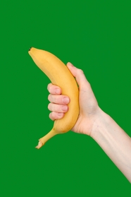手持黄色香蕉手势摄影图片